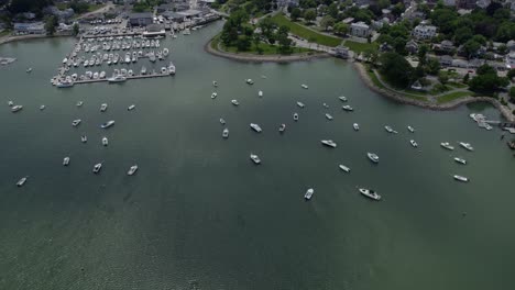 Aerial-view-overlooking-boats-and-the-Safe-Harbor-Plymouth-marina,-summer-in-USA