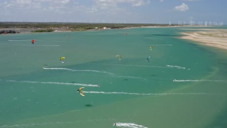 Drone-orbits-above-kitesurfers-in-shallow-water-at-the-Brazil-coastline