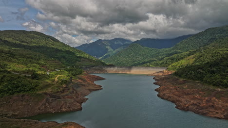 Hornito-Panama-Aerial-v3-cinematic-drone-reverse-flyover-fortuna-reservoir-dam-capturing-pristine-and-serene-landscape-of-brazo-de-hornito-river-and-mountain-view---Shot-with-Mavic-3-Cine---April-2022