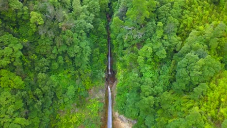 Aerial-dolly-out-revealing-double-waterfall-of-Ribera-Quente-in-the-jungle-of-Sao-Miguel-island,-Azores