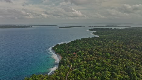 Bocas-del-Toro-Panama-Aerial-v3-flyover-paunch-capturing-pristine-and-serene-seascape-of-tropical-coastal-island-with-dense-lush-green-forest-natural-reserve---Shot-with-Mavic-3-Cine---April-2022