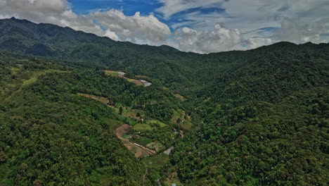 Los-Naranjos-Panama-Aerial-v3-cinematic-drone-flyover-rural-mountain-area-capturing-beautiful-and-pristine-landscape-with-dense-lush-forest-and-hillside-farmland---Shot-with-Mavic-3-Cine---April-2022