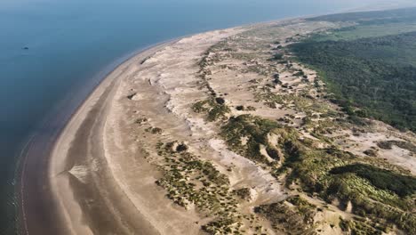 Bird's-eye-view-of-a-secluded,-quiet-beach-outside-Rockanje,-Holland
