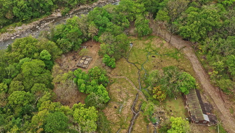 Caldera-Panama-Aerial-v9-low-level-birds-eye-view,-rotating-flyover-secluded-outdoor-hot-springs-capturing-surrounding-nature-environment-along-chiriqui-river---Shot-with-Mavic-3-Cine---April-2022