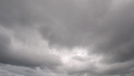 Static-timelapse-of-white-and-grey-clouds-rolling-through-the-sky