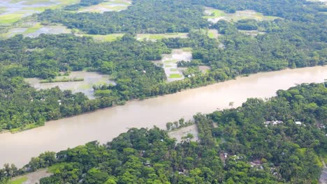 Aerial-view-of-flooded-river,-turning-forest-into-wetlands,-Mass-natural-disasters,-Bangladesh