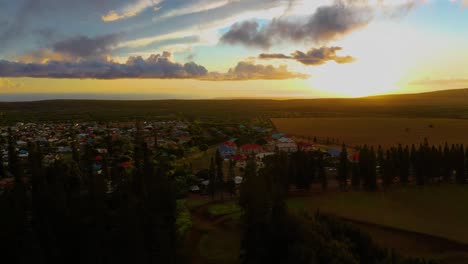 Sunset-aerial-dolly-with-stunning-sky-over-Lanai-City,-Hawaii