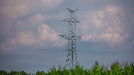 Static-timelapse-of-clouds-moving-behind-powerline-pylon-in-nature