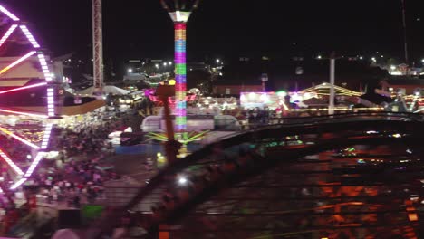 People-Rides-On-Thrilling-Roller-Coaster-At-Washington-State-Fair-At-Night