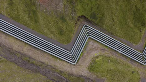 Aerial-top-down-shot-of-geothermal-hot-water-pipeline-in-Iceland