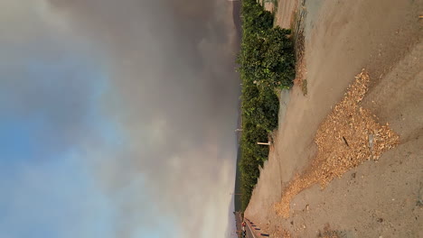 View-of-destructive-wildfire-next-to-road,-evacuation-of-the-fire-area,-natural-disaster