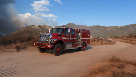 Firefighters-truck-speeding-on-a-dirt-road