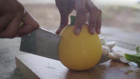 Cutting-a-squash-with-a-chef's-knife