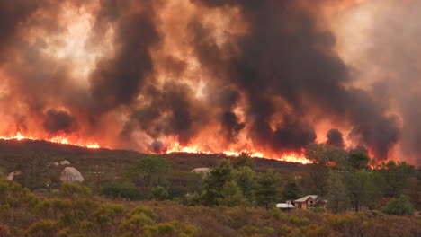 Timelapse-of-deadly-wildfire-coming-towards-a-house-in-a-hill-forest