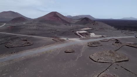 Aerial-shot-of-road-in-the-volcanic-area-in-Lanzarote