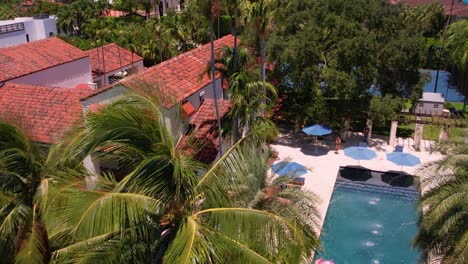 Aerial-Footage-of-Miami-Beach-Mansion-with-Pool-with-Tropical-Palm-Trees-Drone-Paradise-Waterfront