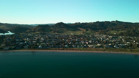 Flying-drone-into-beach-side-holiday-town-in-New-Zealand