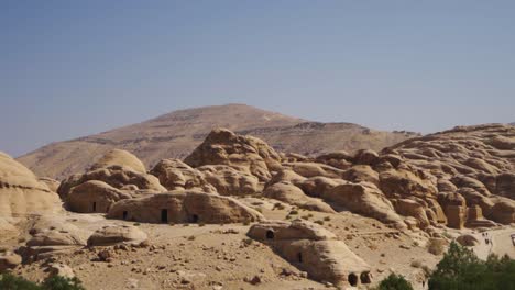 Ancient-Petra-city-ruins-in-Petra-desert,-Jordan,-handheld-pan-right