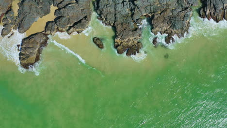 4K-Aerial-Drone-Birds-Eye-View-Over-Rocky-Beach-Shore-In-Australia