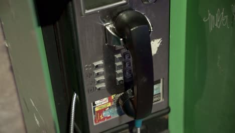 Old-green-payphone-box-in-downtown