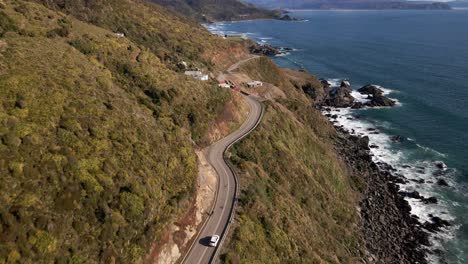 Aerial-push-in-shot-of-highway-in-a-cliff-on-the-coastline-in-Chile