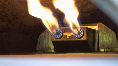 Pizza-oven-gas-flames-burn-brightly-heating-up