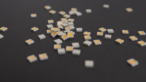 Dropping-Small-SMD-LEDs-on-Black-Background