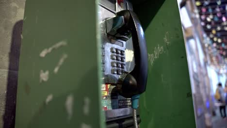Old-tech-payphone-booth-in-downtown