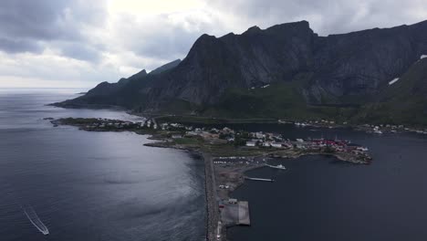 Aerial-of-Reine,-Norway-reveals-lighthouse-and-Aqua-Lofoten-Coast-Adventure
