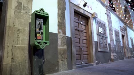 Old-green-telephone-box-in-the-street