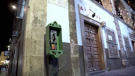 Old-green-telephone-box-in-downtown