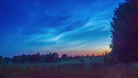 Timelapse-shot-of-gentle-pastel-sky-at-sunset-with-cirrus-clouds-passing-by-over-rual-landscape