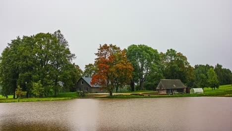 A-cozy-cottage-by-a-lake-on-a-windy-autumn-day---time-lapse