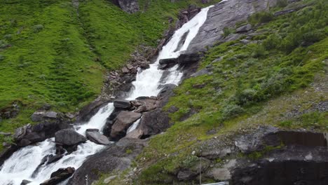 Aerial-revealing-Sendefossen-waterfall-close-to-road-RV13-at-vikafjellet-mountain-in-western-Norway