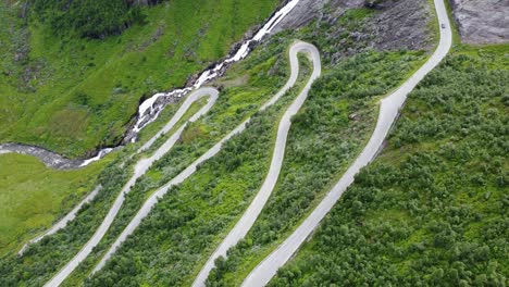 Amazing-winding-roads-leading-to-Vikafjellet-mountain-crossing-along-RV13-between-Voss-Vestland-and-Vik-in-Sogn---Unique-aerial-looking-down-at-crazy-roads-with-180-degree-curves