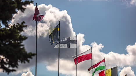 Flags-from-European-nations-flapping-in-the-wind-with-billowing-clouds-in-the-background---time-lapse
