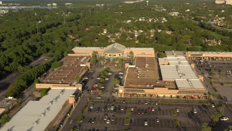Drone-view-flying-towards-the-center-court-area-of-Silver-Sands-Outlet-Mall-in-Destin-Florida