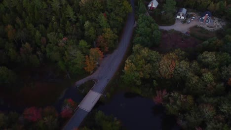 A-pan-out-shot-of-a-small-town-back-road-and-river-in-Maine