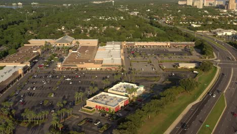 Drone-view-panning-left-from-Highway-98-to-Silver-Sands-Outlet-Mall-in-Destin-Florida