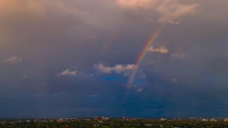 Aerial-timelapse-of-a-Rainbow--with-clouds