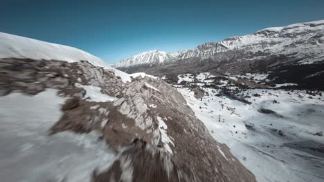 FPV-aerial-of-the-French-Alps-in-France,-Flying-over-rocky-mountain-terrain
