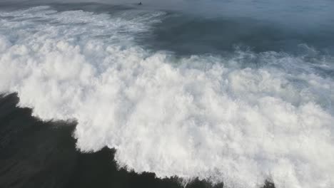 Close-drone-shot-of-a-wave-at-Santa-Teresa-beach-in-Costa-Rica