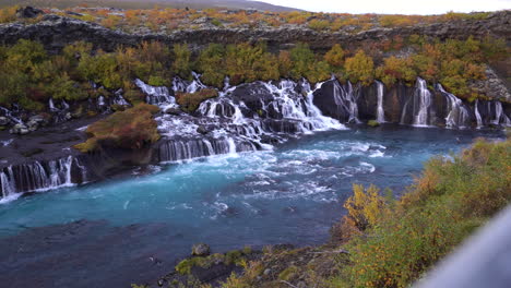 Iceland-scenic-natural-stunning-landscape-in-autumn-season-Hraunfossar-waterfall-famous-touristic-spot-destination