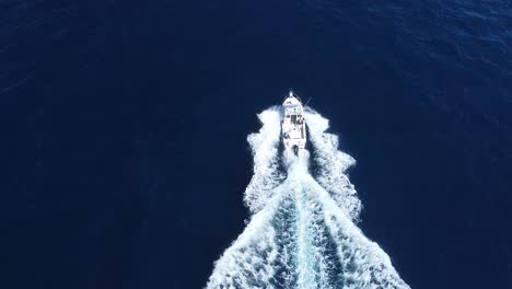 Boat-driving-through-the-water-drone-shot