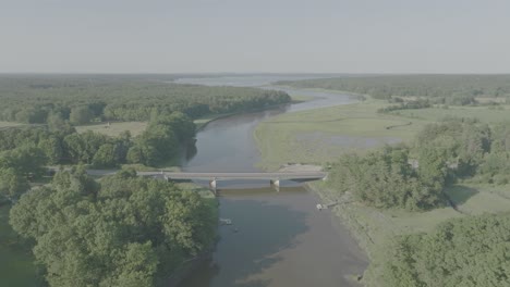 Rising-Aerial-crane-shot-New-Hampshire-bridge,-cars,-and-river