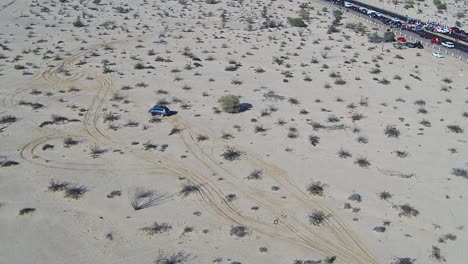 View-of-a-drone-flying-circles-beside-a-highway-in-the-middle-of-the-desert