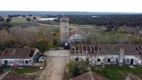Smooth-aerial-scene-of-ruined-church-and-abandoned-town