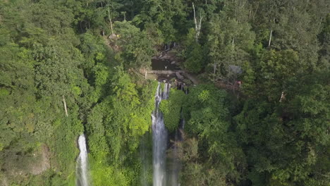 Tourists-enjoy-view-as-aerial-retreats-from-lush-Bali-jungle-waterfall