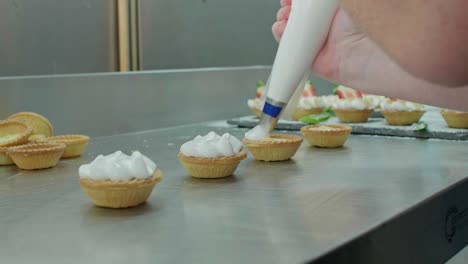 Piping-cream-into-pastry-shells