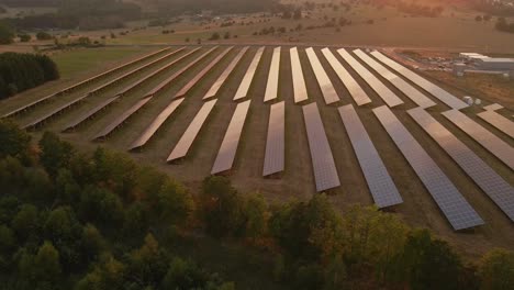 Establishing-drone-footage-of-a-large-solar-farm-at-sunset